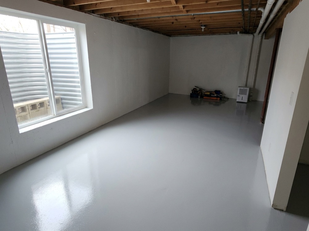 Installed sump pump and dry finished basement after waterproofing in Surrey